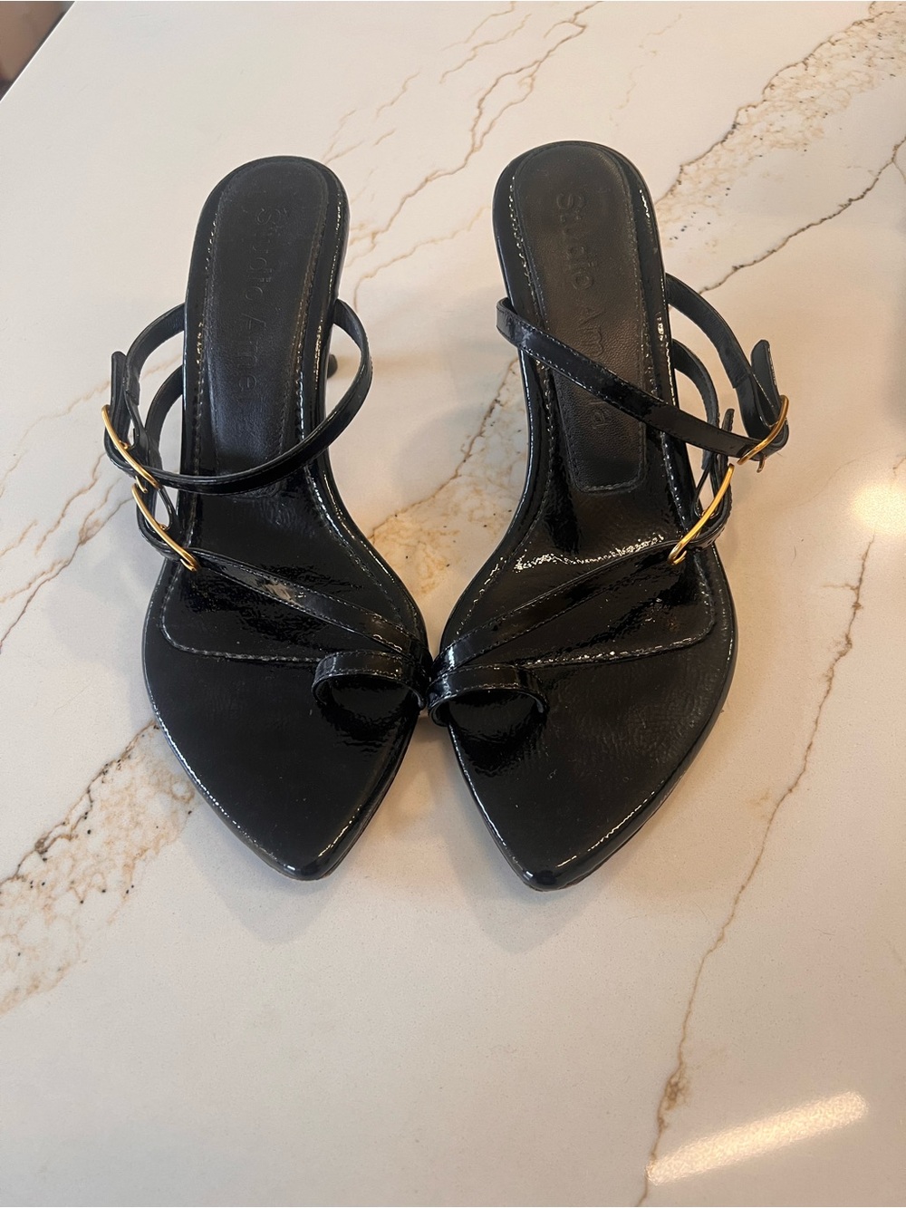 STUDIO AMELIA Black Patent Pointed-Toe Strappy Heels with Gold Buckles